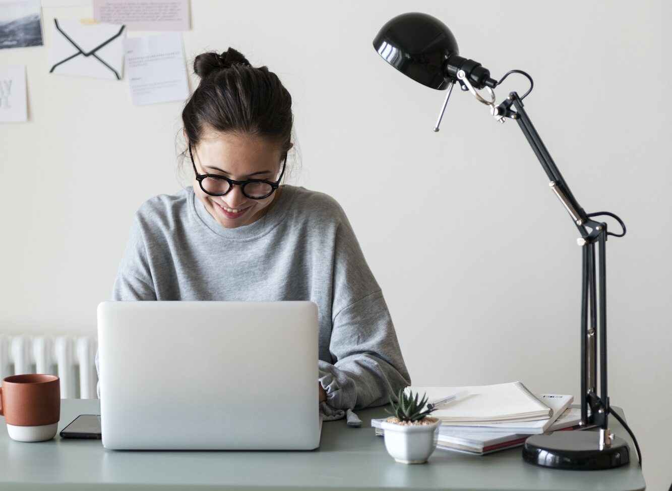 Woman working on a laptop in her home